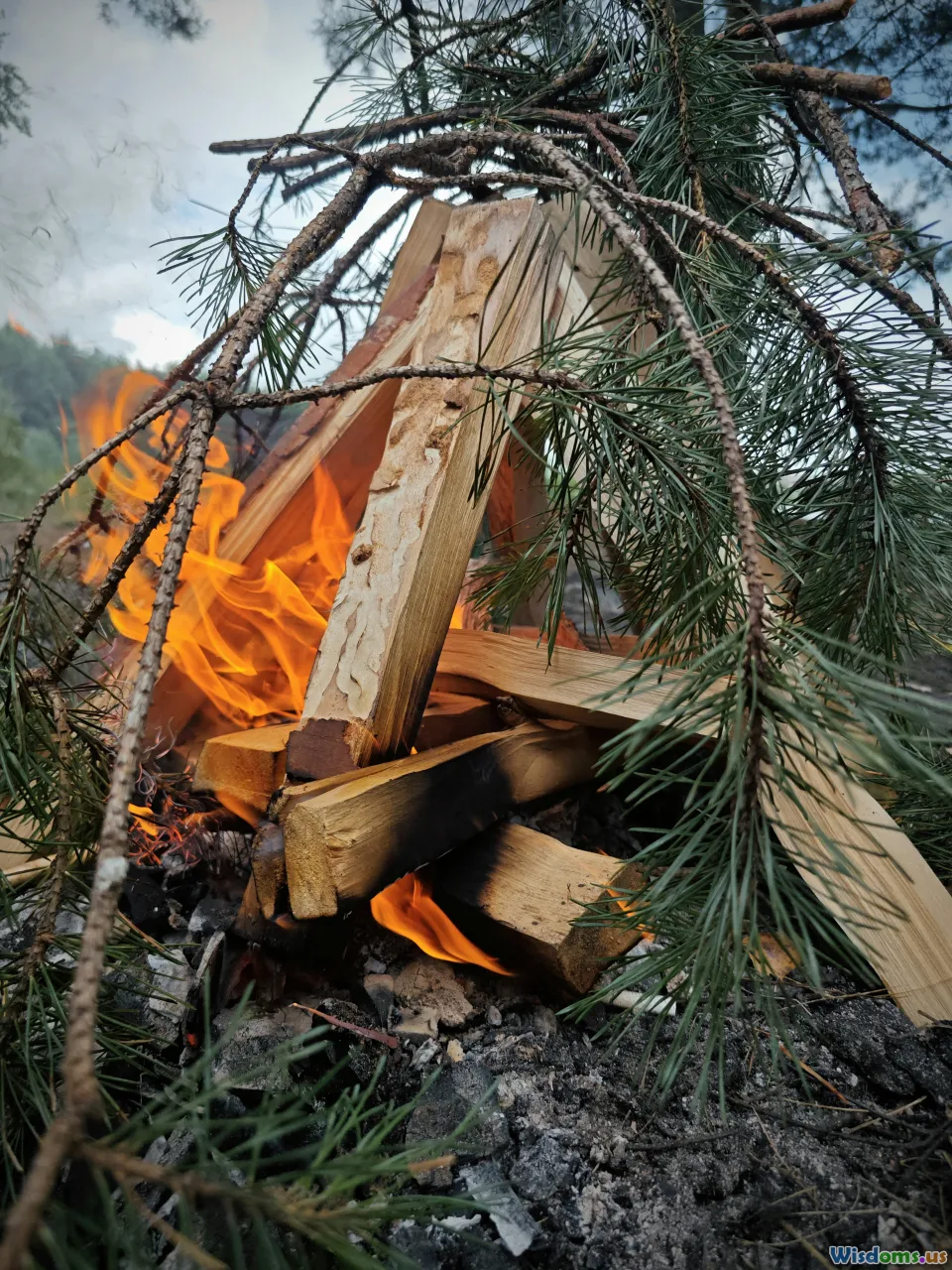 campfire melting snow, survival gear, emergency shelter